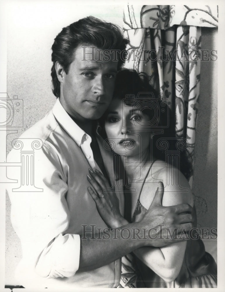 1987, Susan Lucci and John James star in "Haunted by her Past" - Historic Images