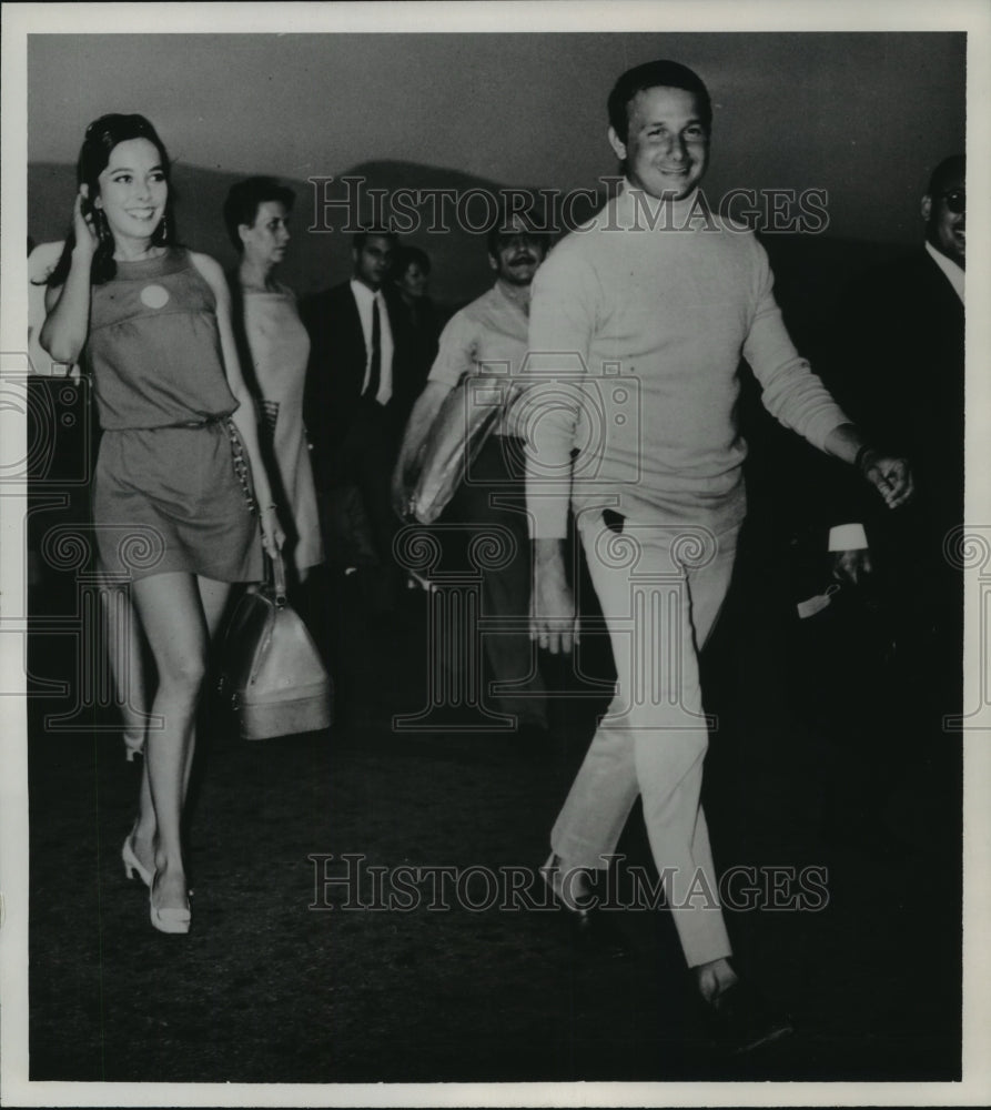 1968, Josephine Chaplin &amp; fiancee, Nikos Sistovaris at Athens airport - Historic Images