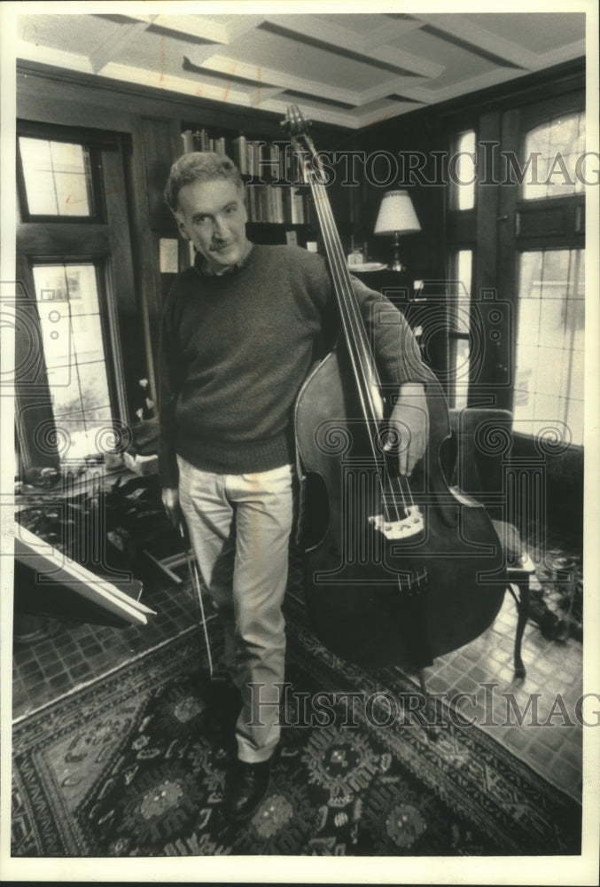 1991 Roger Ruggeri, bassist, practices at home - Historic Images