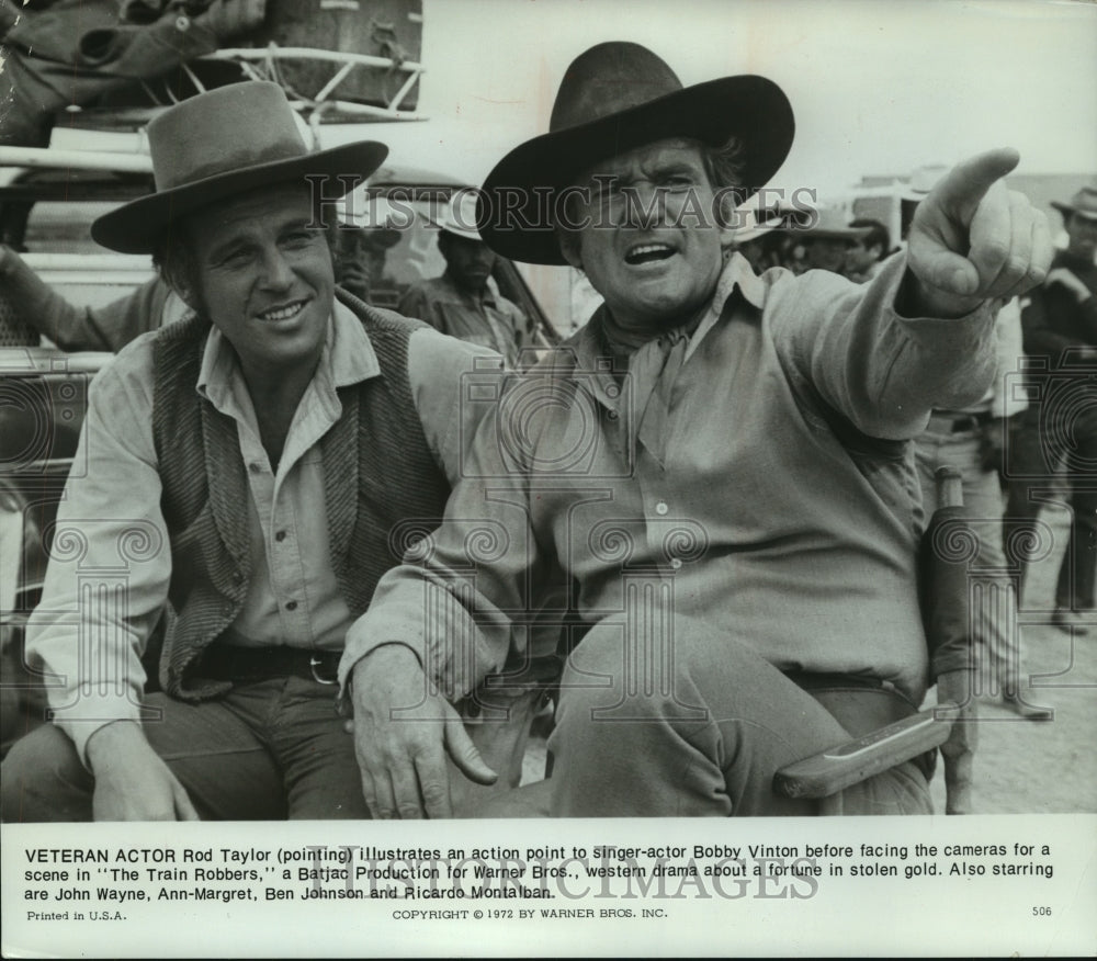 1972, Actor Rod Taylor and Bobby Vinton in "The Train Robbers." - Historic Images