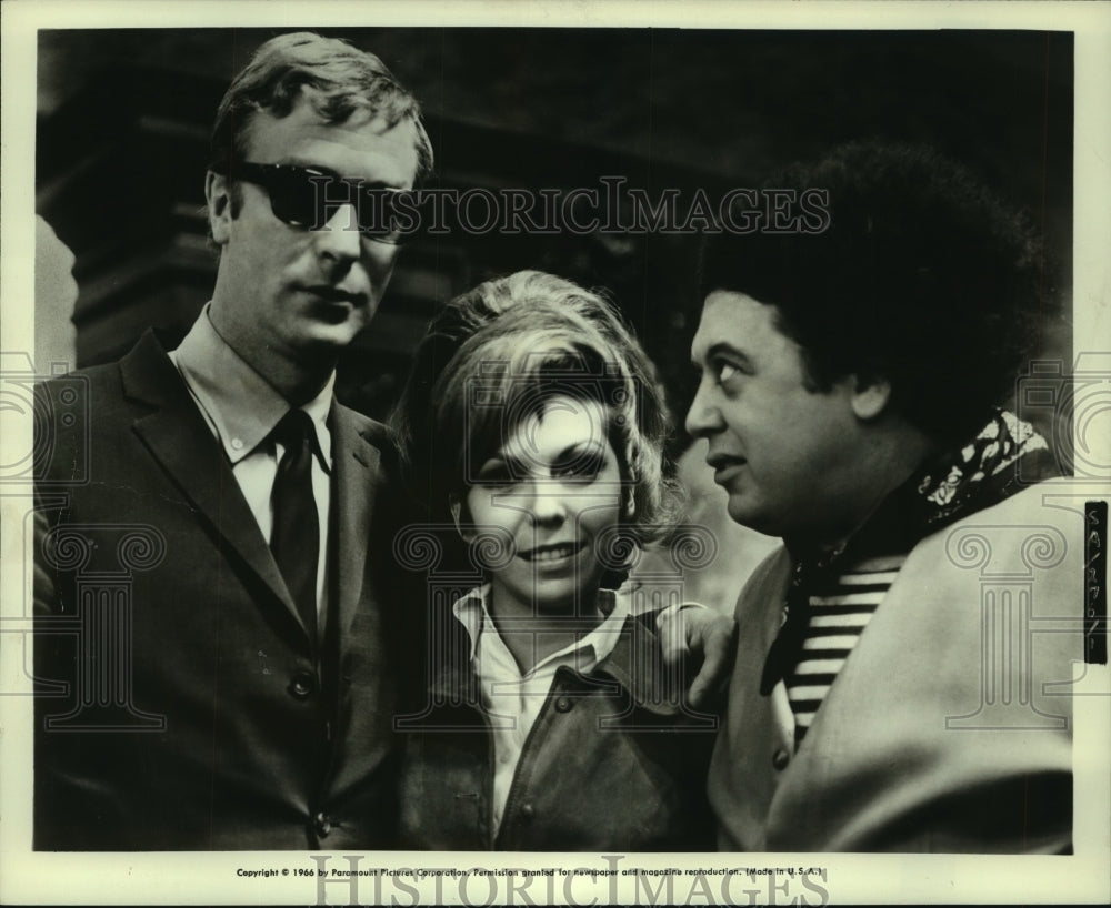 1966, Marty Allen with Michael Caine and Nancy Sinatra on set - Historic Images