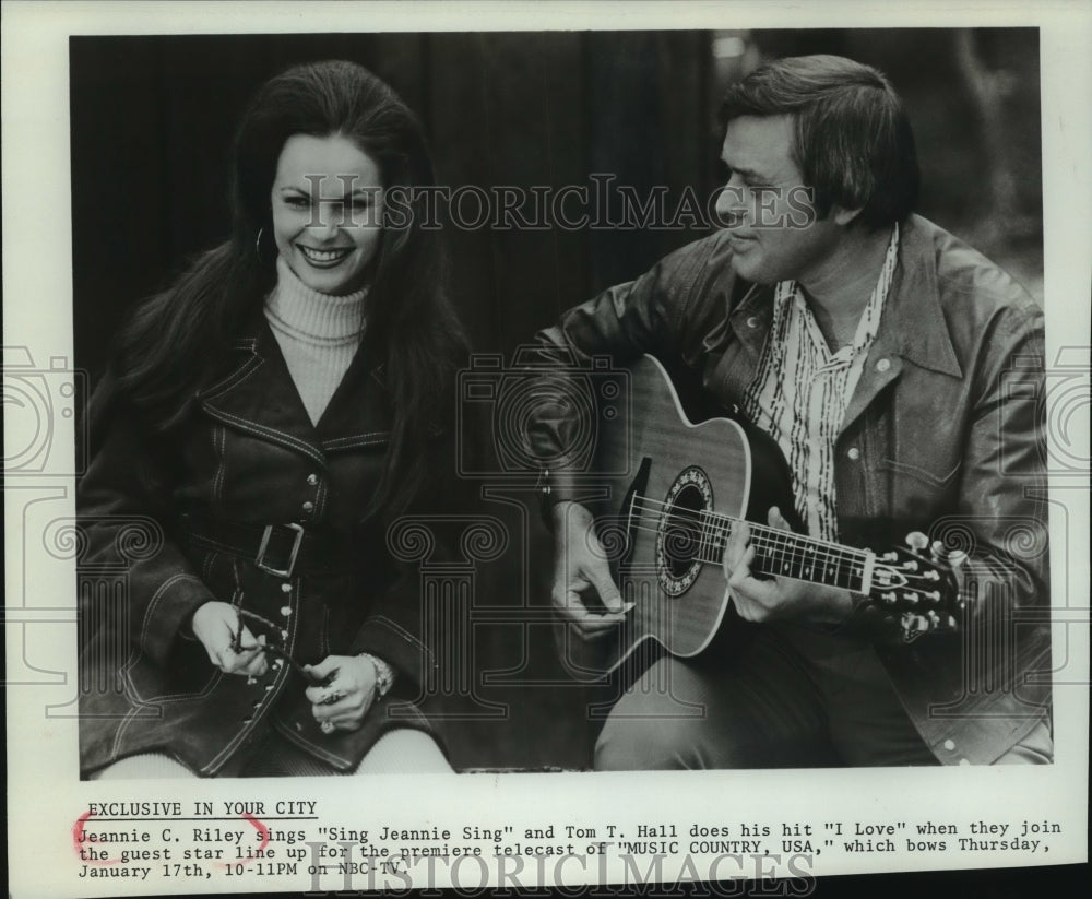 1974, Jeannie C Riley, Tom T. Hall, sing on set of Music Country USA - Historic Images