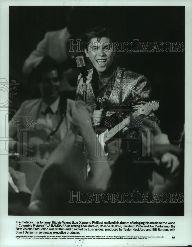 1986, Lou Diamond Phillips playing guitar in movie "La Bamba." - Historic Images