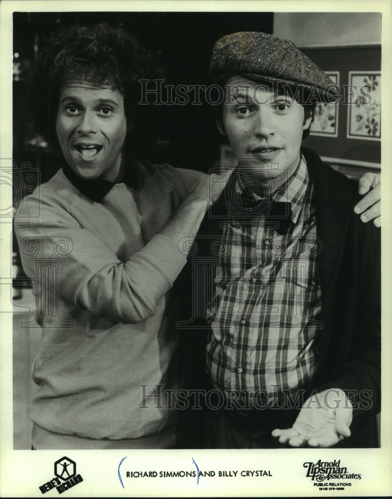 1985, TV host Richard Simmons with actor/comedian Billy Crystal - Historic Images