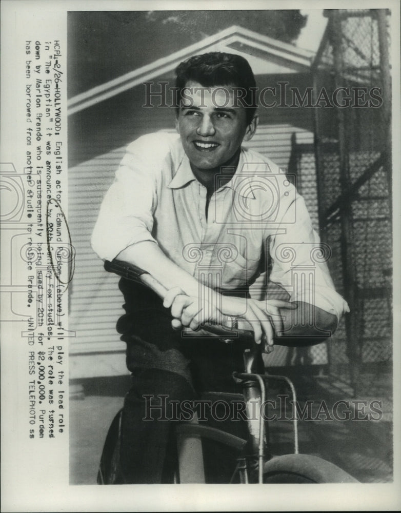 1954, Edmund Purdom sits on bike, star of the movie The Egyptian - Historic Images