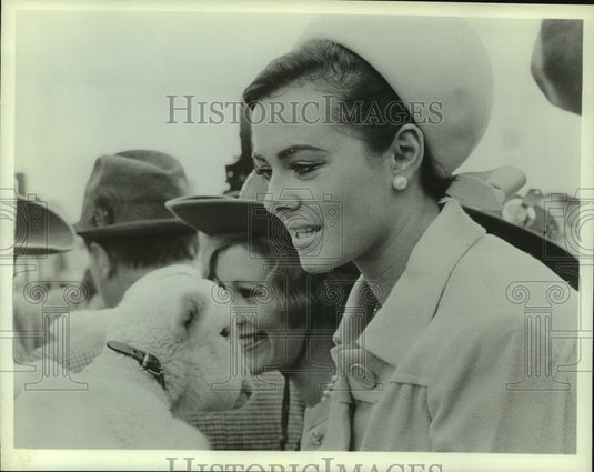 1965, Ann Sidney, others, greet mascot Willie Wool Mark, Los Angeles. - Historic Images