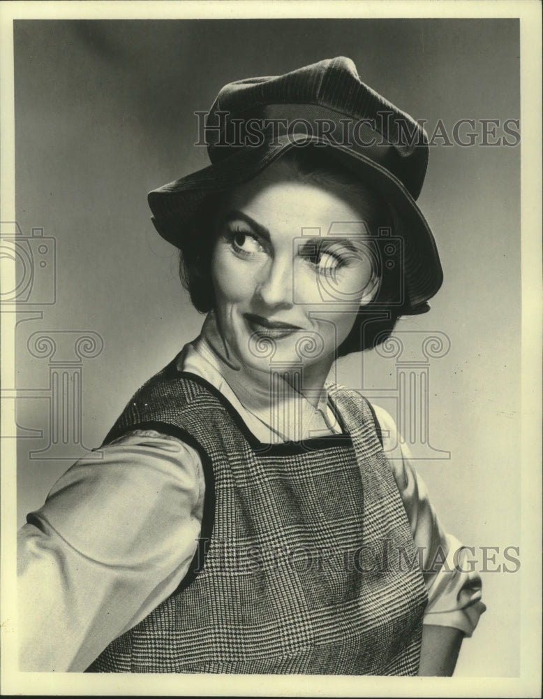 1960, German film actress Ursula Thiess poses in hat &amp; dress - Historic Images