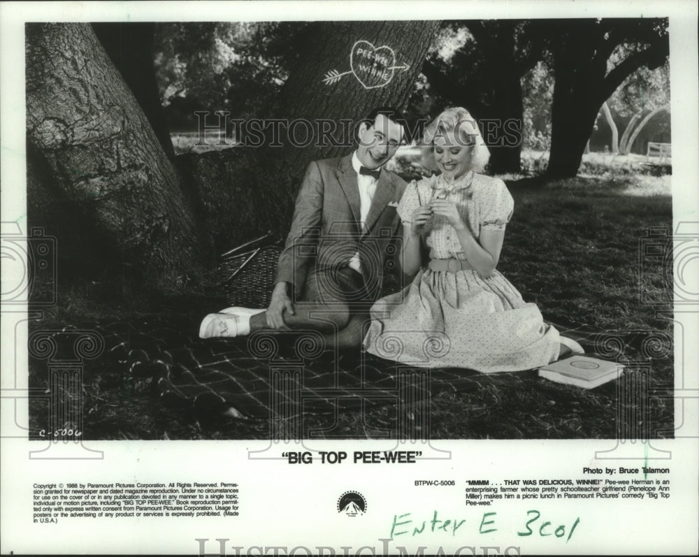 1988, Actors Paul Reubens & Penelope Ann Miller in "Big Top Pee-Wee" - Historic Images