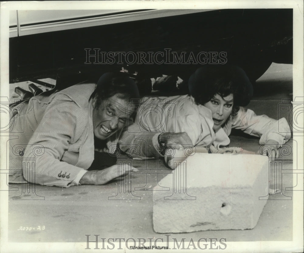 1974, Actors Charlton Heston & Ava Gardner in the movie "Earthquake" - Historic Images