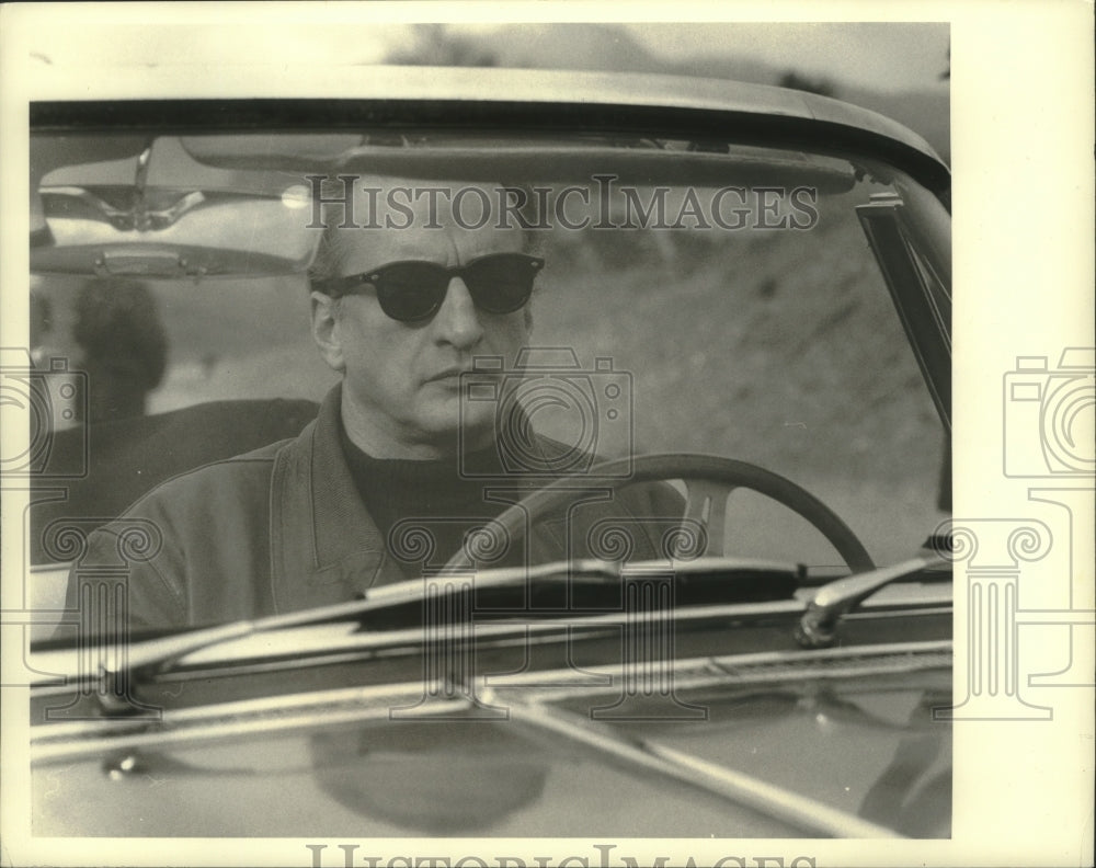 1971, Actor George C Scott behind the wheel of a car in, The Last Run - Historic Images