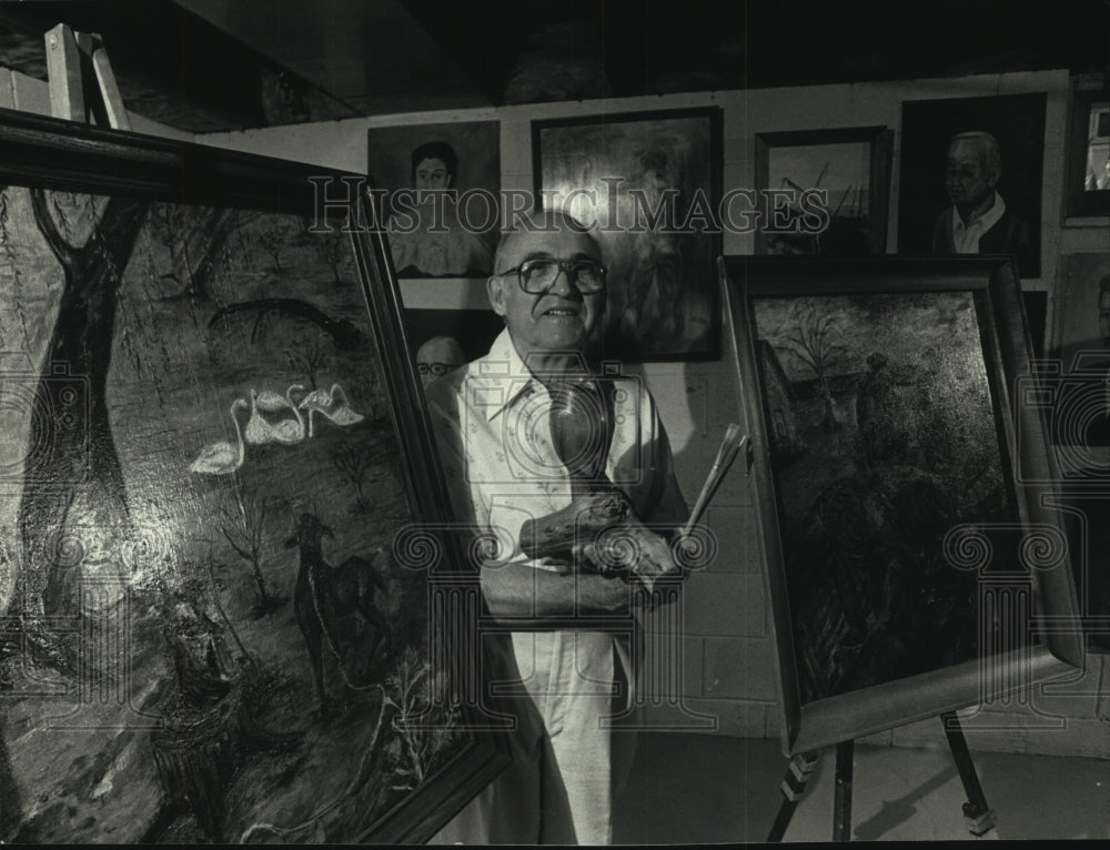 1991, Artist Hugo Roman with his oil paintings &amp; wood carving, WI - Historic Images