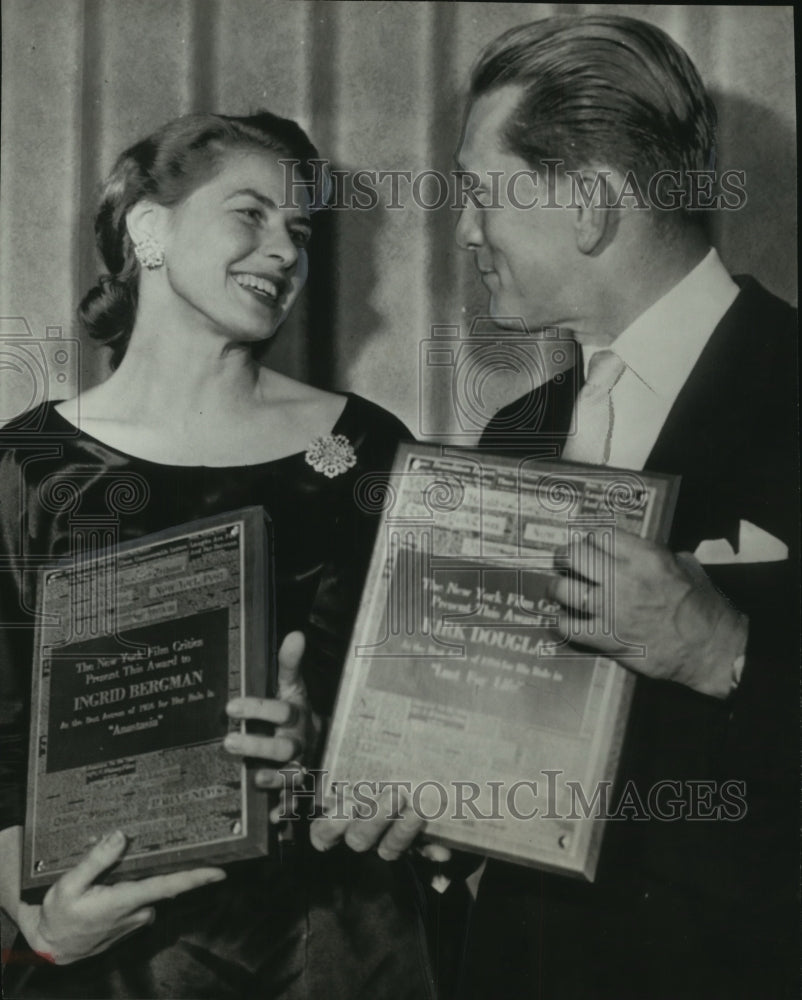 1957, Actress Ingrid Bergman and Actor Kirk Douglas Receiving Awards - Historic Images