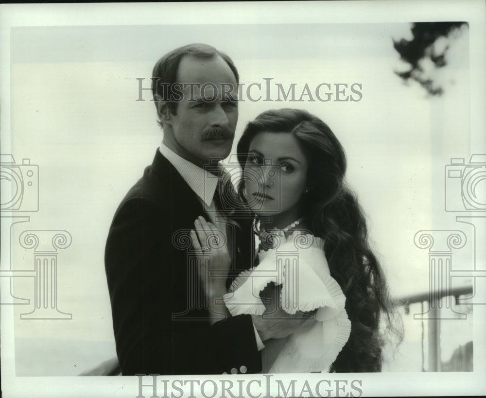 1983, Gerald McRaney and Jane Seymour star in "The Haunting Passion" - Historic Images