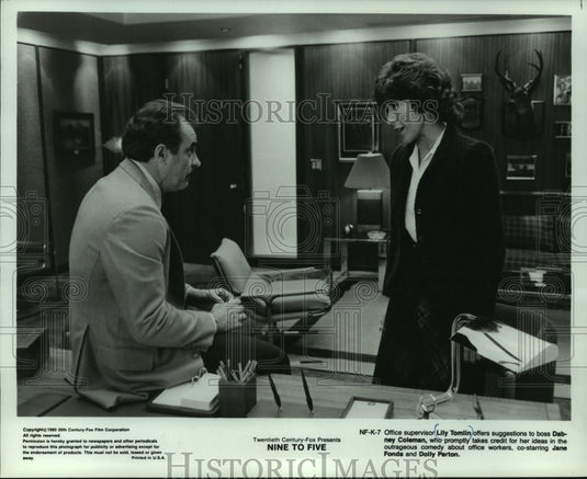 1980, Actress Lily Tomlin & co-star talk in a office, "Nine To Five" - Historic Images