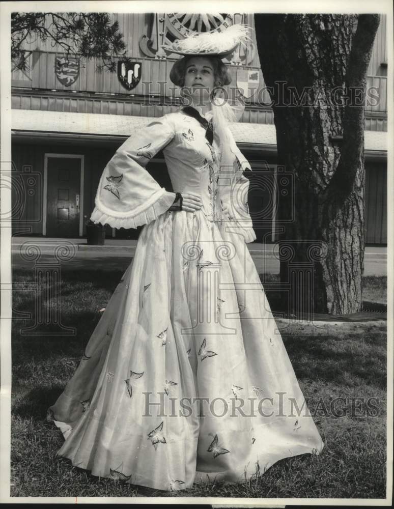 1929 Actress Kim Hunter in old fashion gown stands in front of tree - Historic Images