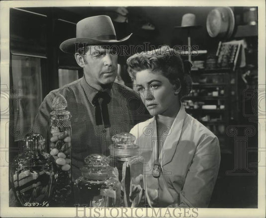 1956, Fred MacMurray and Dorothy Malone in scene from "At Gunpoint" - Historic Images