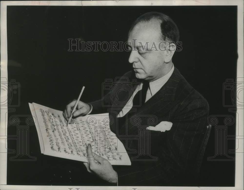 1956, Virgil Thomson, composer and music critic, goes over a score - Historic Images