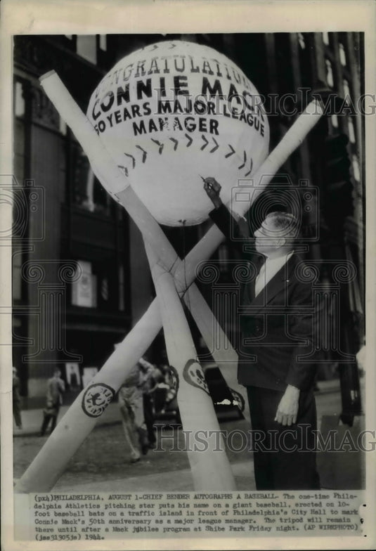 1944 Press Photo Chief Bender Autorgraph's Large Baseball to Honor Connie Mack - Historic Images
