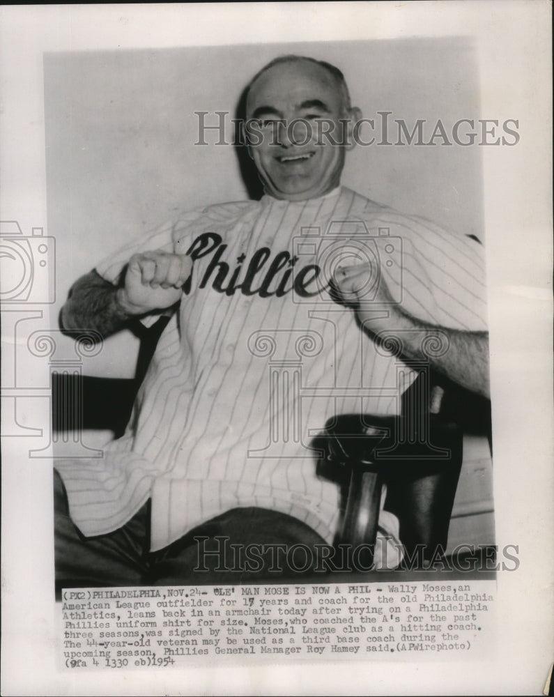 1954 Press Photo Wally Moses tries on a Philadelphia Phillies uniform for size. - Historic Images
