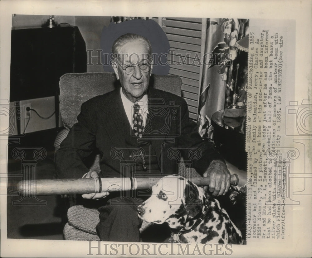 1949 Press Photo Charles Nichols holds a 1885 souvenir bat. - mjs04417-Historic Images