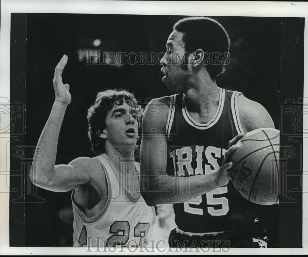 1977 Don Williams keeps the ball away from Marquette&#39;s Jim Boylan - Historic Images