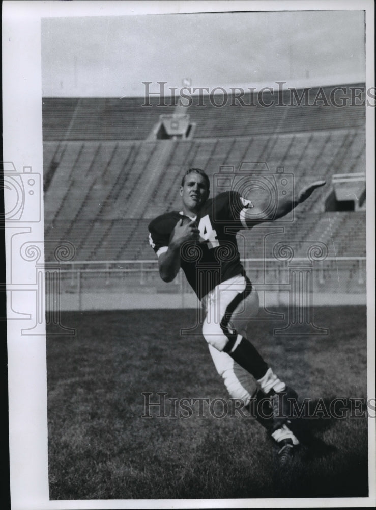 1965 Wisconsin football player, Tom Jankowski, with the ball - Historic Images