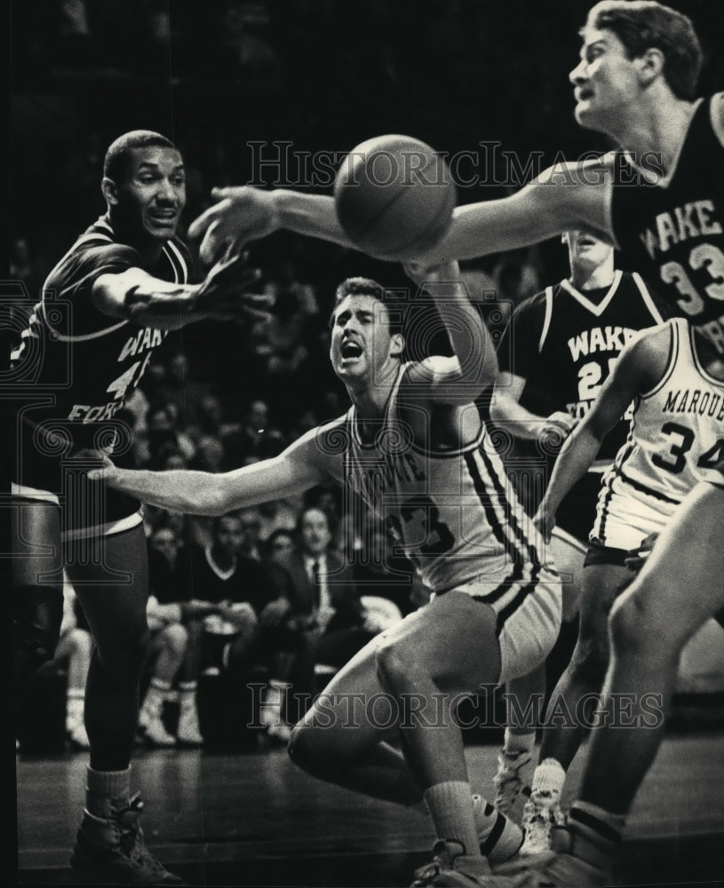 1988 Basketball players Sam Ivy, Pat Foley, Ralph Kitley in action - Historic Images