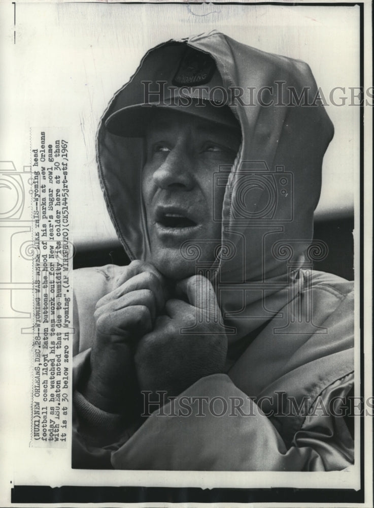1967 Wyomings' coach Lloyd Eaton bundled up against New Orleans cold - Historic Images