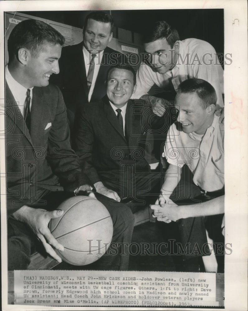 1963 New University of Wisconsin basketball coach (L) with players. - Historic Images