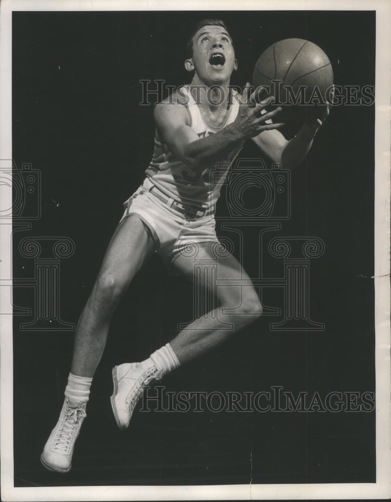 1949 Press Photo Johnny Erickson, Beloit College basketball player jumping.- Historic Images