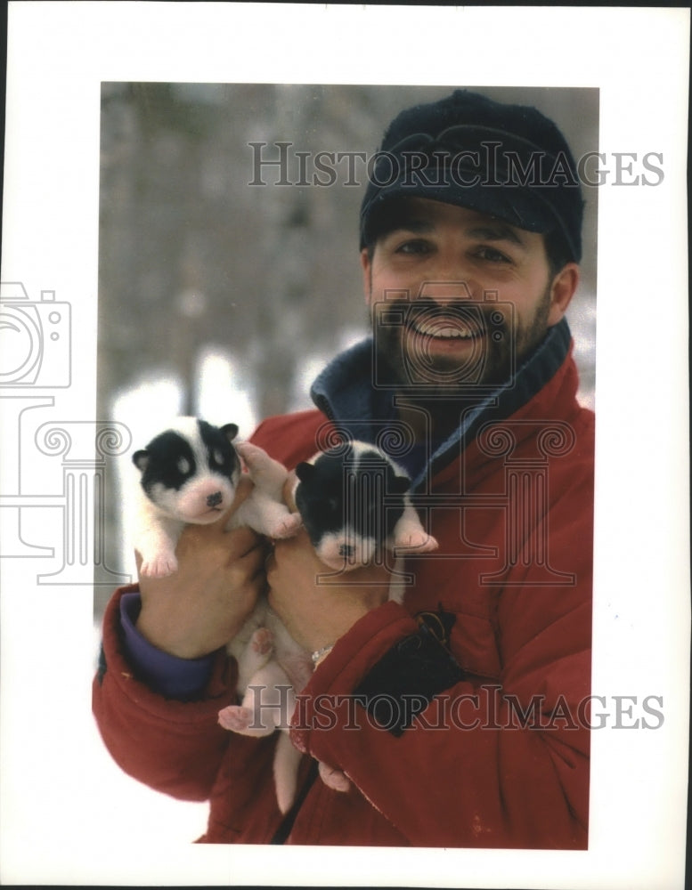 1954 Minnesota Dog-Sledder Lonnie Dupre Holds Two Sled Dog Puppies - Historic Images