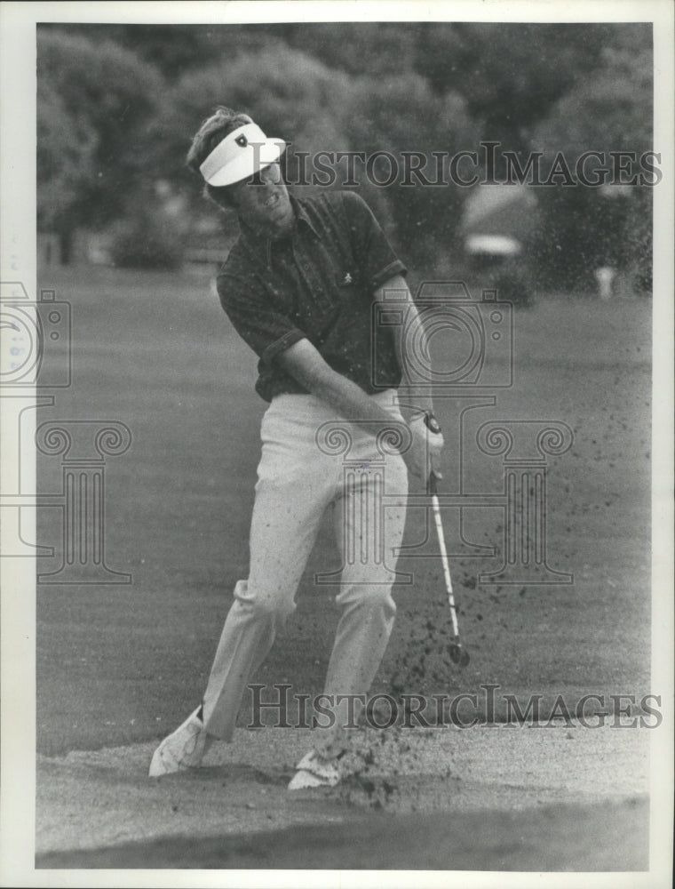 1974 Press Photo Professional golfer Rolf Deming hitting out of sand trap.- Historic Images