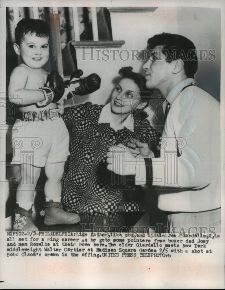 1958 Joey Giardello & mom gives their son, Joey (2) some pointers. - Historic Images