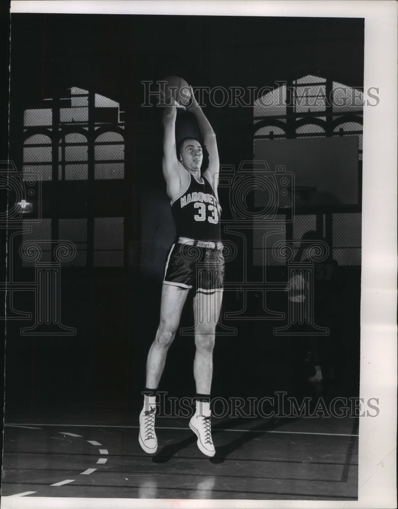 1961 Ron Glaser, Junior guard for University of Marquette jumping. - Historic Images