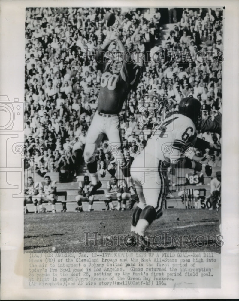 1964 Bill Glass of Cleveland Browns intercepts Johnny Unitas pass. - Historic Images