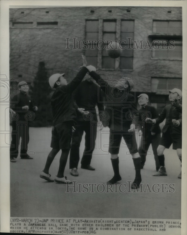 1946 Press Photo Japanese Prince Akihito on school grounds, playing with others.- Historic Images