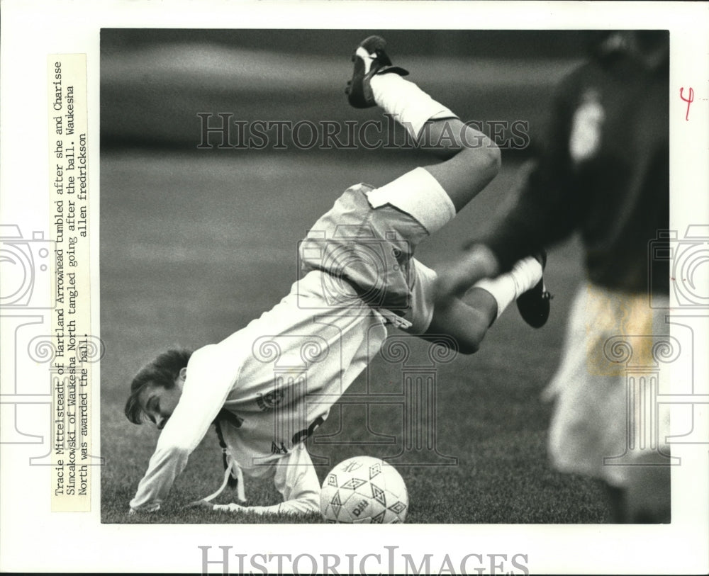 1990 Press Photo Arrowhead High School soccer player Tracie Mittelsteadt tumbles- Historic Images
