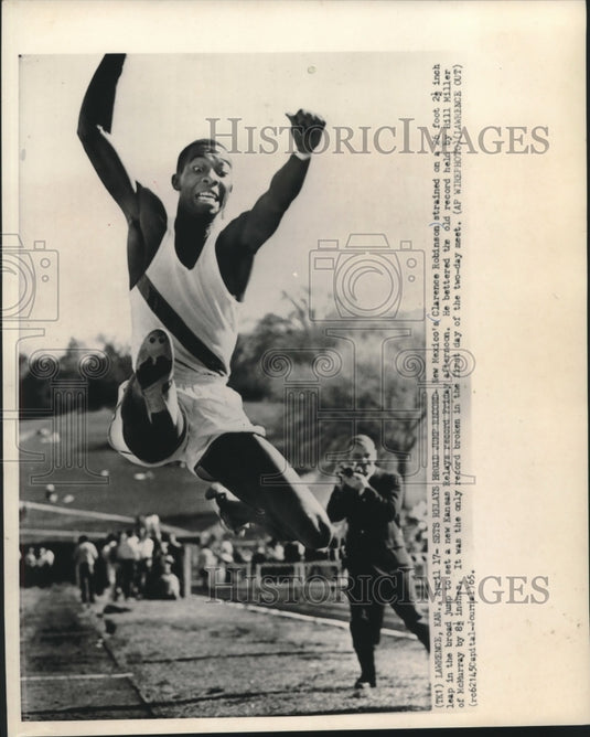 1965 Clarence Robinson sets broad jump record at Kansas meet - Historic Images
