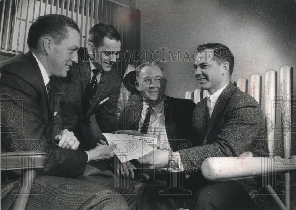 1961 James Prigge Buys Tickets from Executives at County Stadium - Historic Images