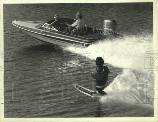 1984 A water skier rides the waves on one of Wisconsin's lake - Historic Images