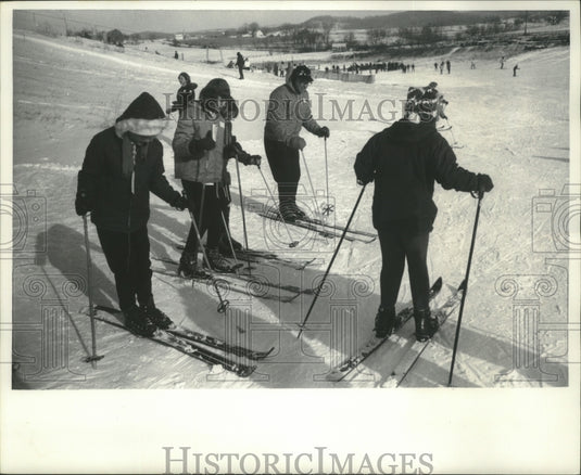 1965 William Straub teaching girls how to negotiate slopes and skies - Historic Images