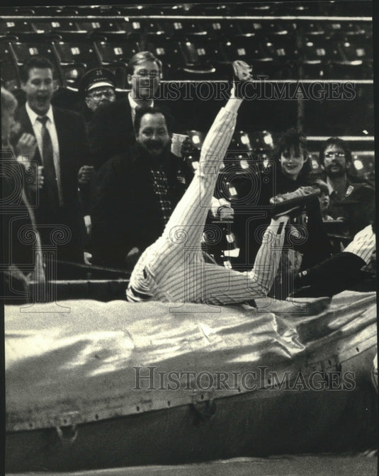 1991 Milwaukee baseball's Dale Sveum falls over after catching ball - Historic Images