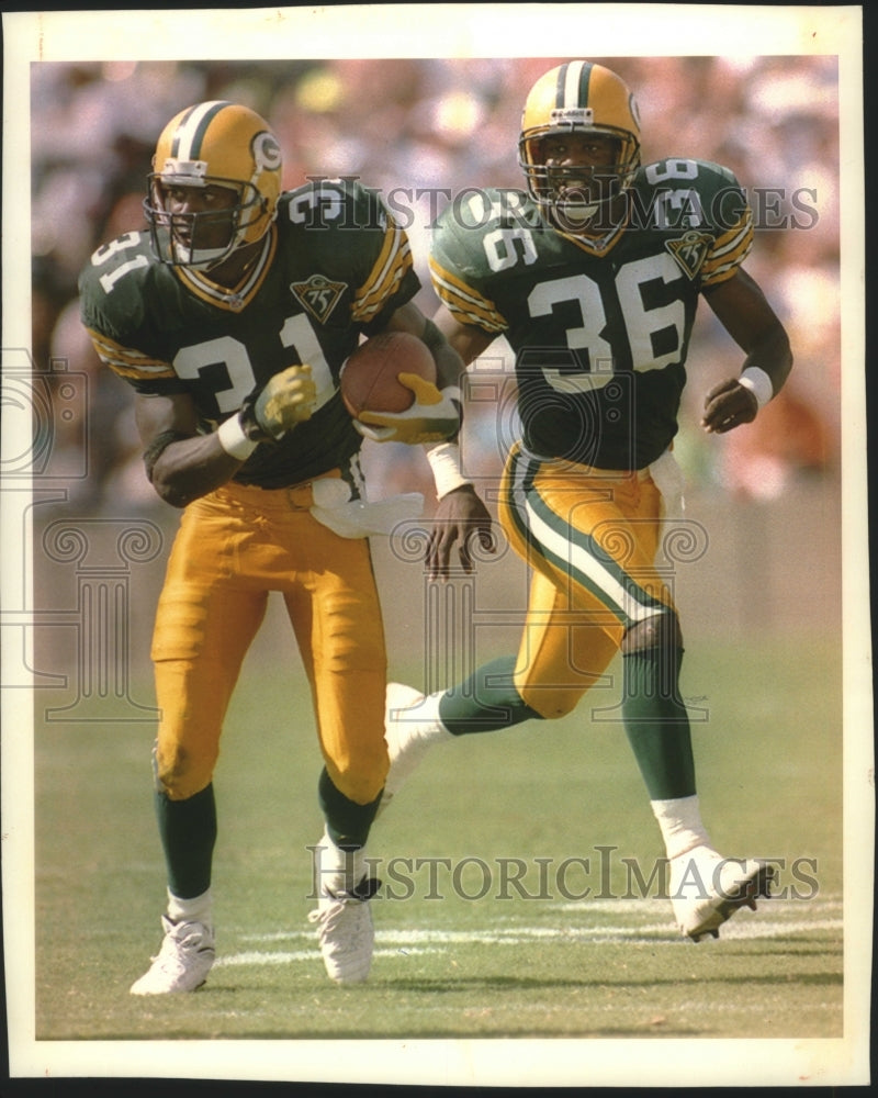 1995 Packers football safeties George Teague, LeRoy Butler in action - Historic Images