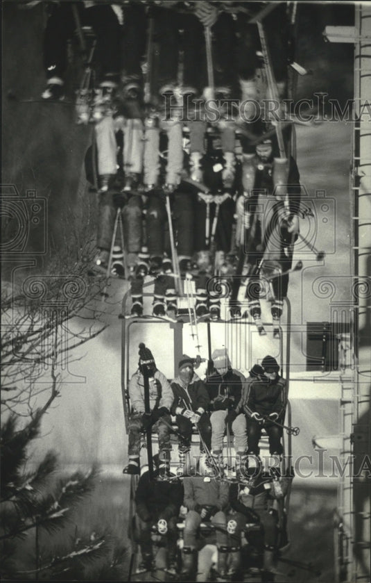 1985 Skiers ride the chairlift - Historic Images