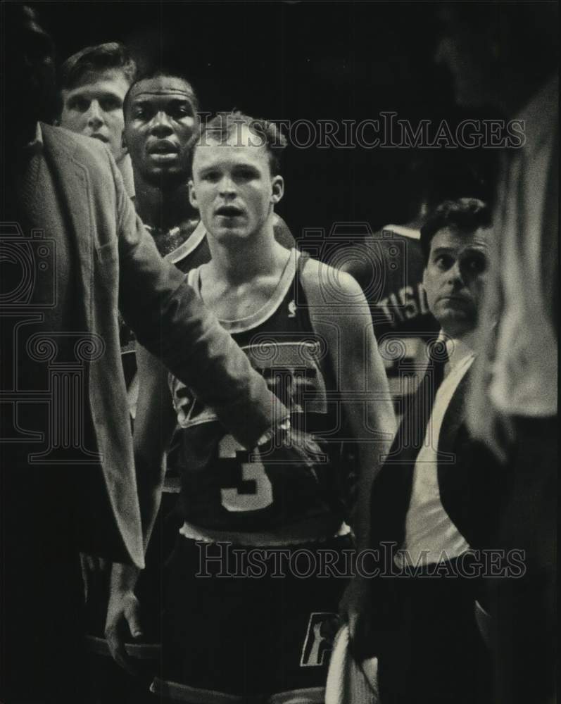 1968 An angry Scott Skiles had to be restrained at a basketball game - Historic Images