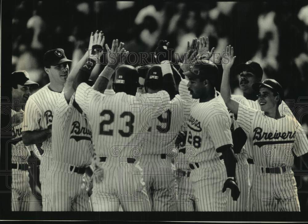 1991 Brewers&#39; Greg Vaughn congratulated after 9th inning grand slam. - Historic Images