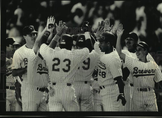 1991 Brewers' Greg Vaughn congratulated after 9th inning grand slam. - Historic Images