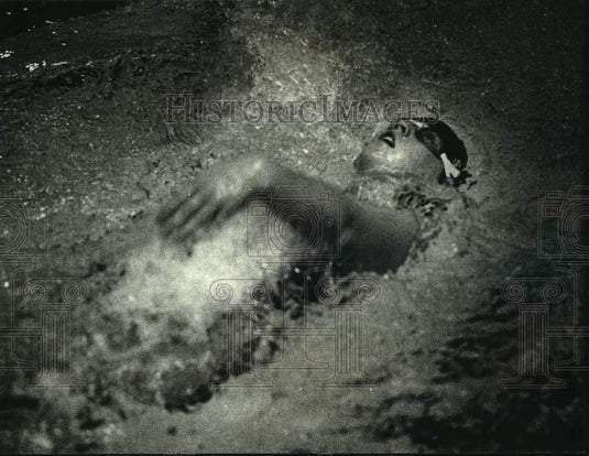 1990 Waukesha South's Daard Sizonore swims backstroke in relay event - Historic Images