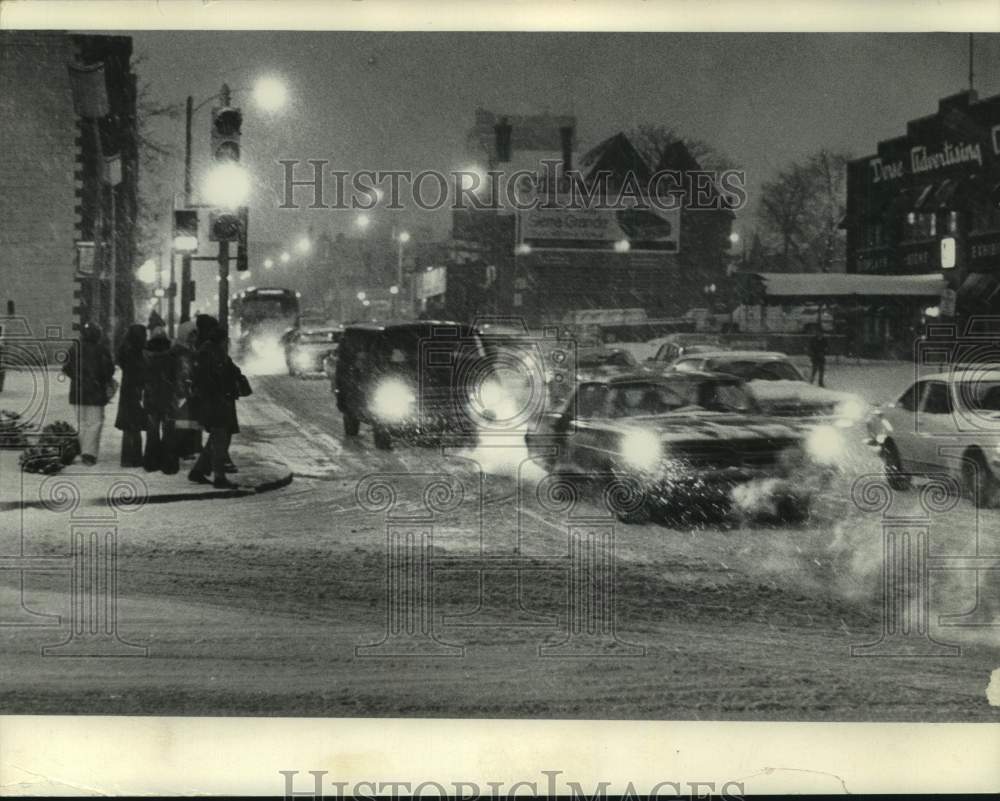 1974 Unexpected snow fall slowed rush hour traffic in Milwaukee, Wis - Historic Images