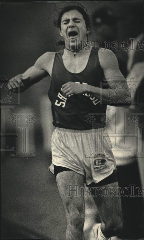 1991 Press Photo Aleks Kostich, Shorewood H.S. runner finishes race, others. - Historic Images